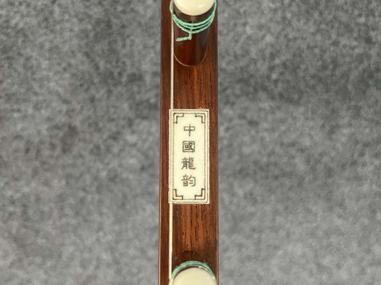 A reticulated celadon jade 'dragon' plaque, Eastern Zhou